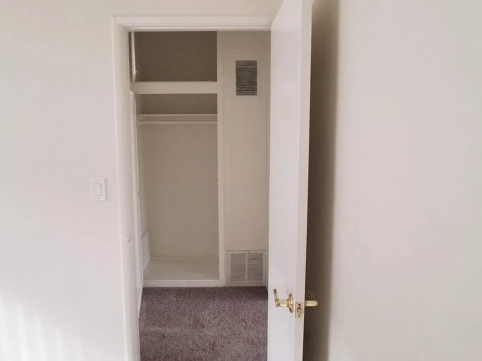 HALL CLOSET FROM BEDROOM
