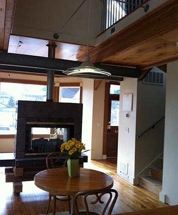 View from dining through two sided fireplace into living roo