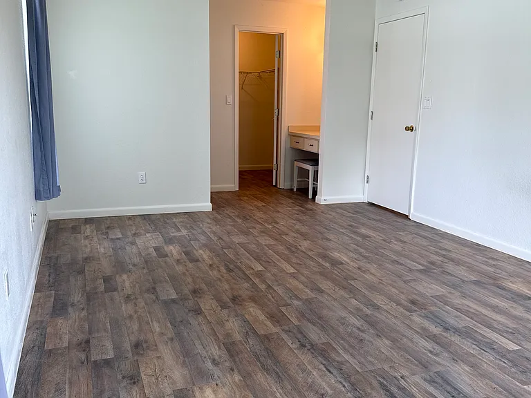 Master Bedroom from far corner showing walk-in closet and makeup sitting area