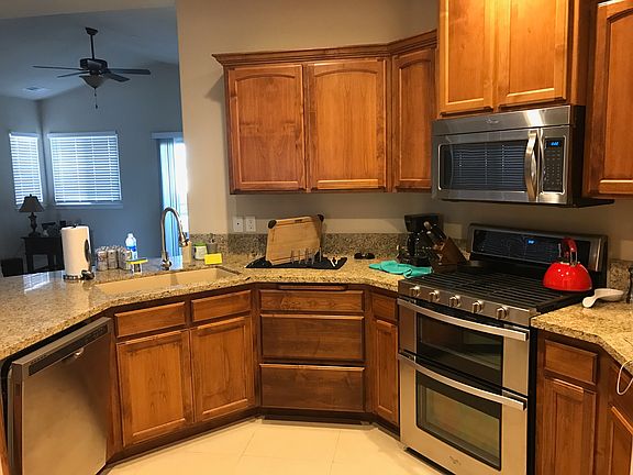 Kitchen with granite countertops and updated appliances.