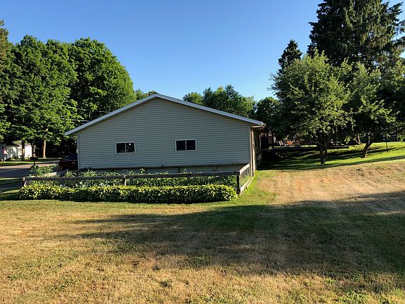 Side of garage with garden