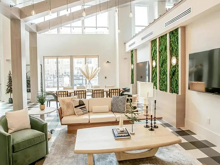 Open-Concept Clubroom with Vertical Garden Wall, Lounge Seating & Dining Table