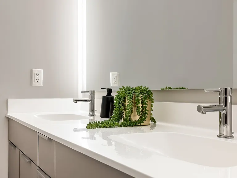 Indulge in tranquility with Modera Montville's serene bathrooms, boasting dual vanities and elegant marble countertops.