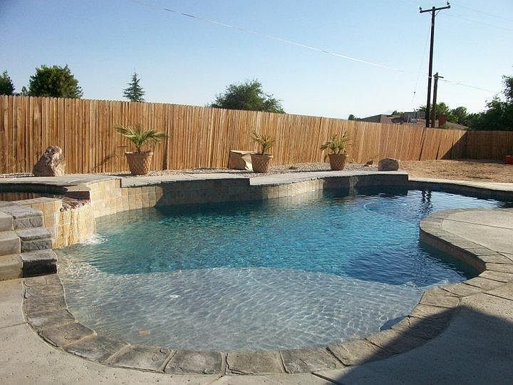 beautiful pool and spa owner pays for pool service