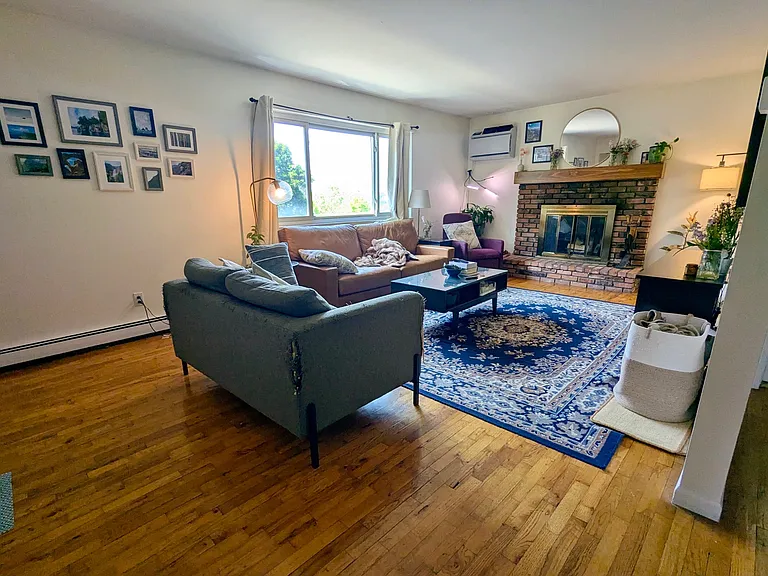 Living room with fireplace and seasonal riverview