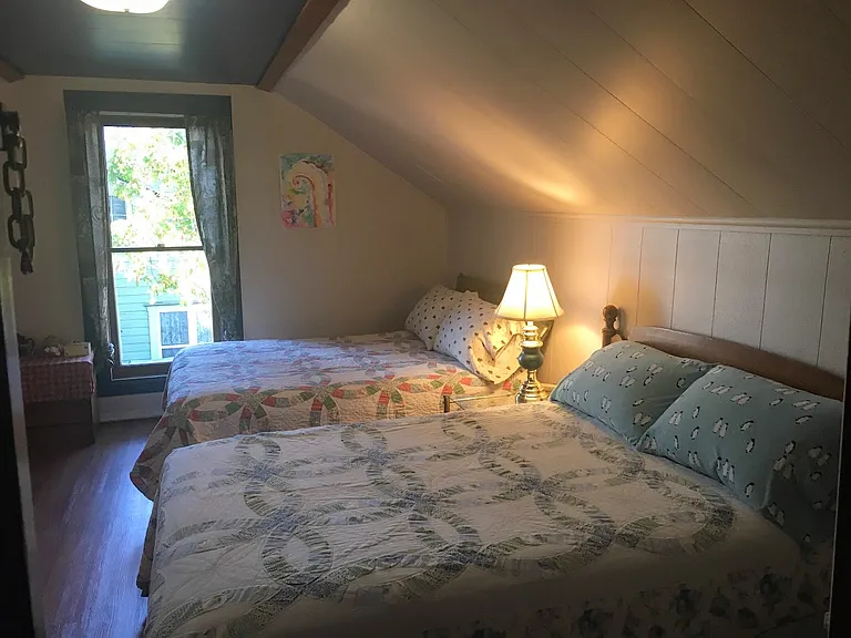 This is another set up with two full sized beds set up in upstairs room above the downstairs room