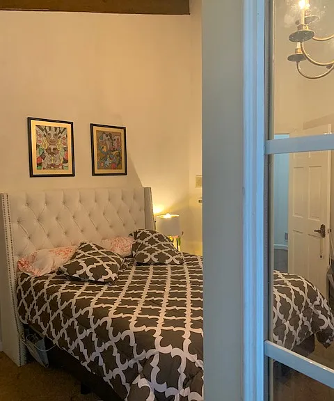 Master bedroom from entering from french doors and deck.