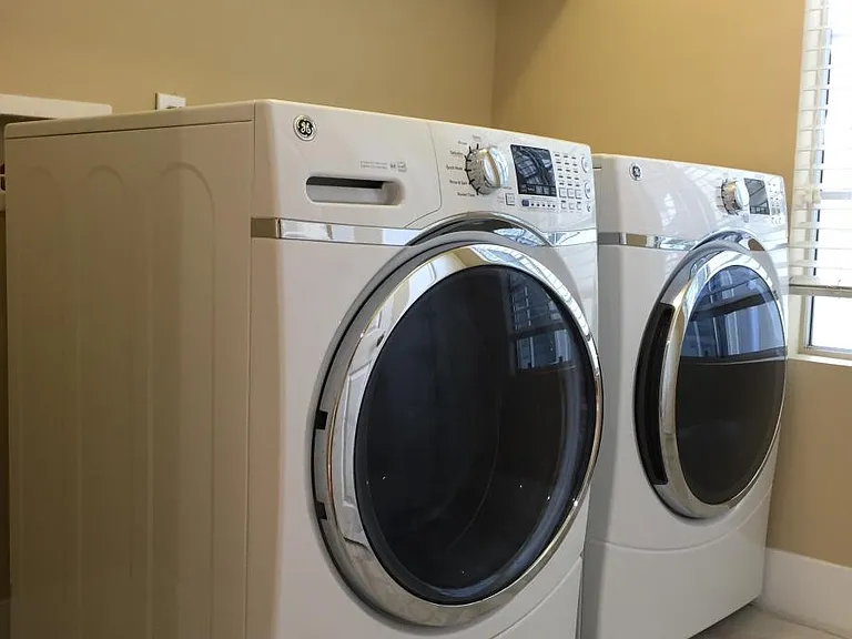 Laundry room with new washer + dryer