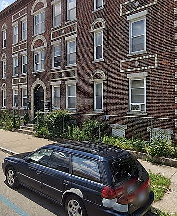 3 story brick & white marble