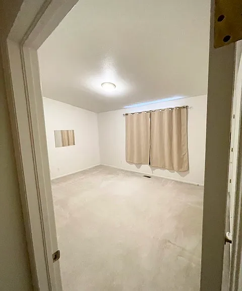 Large master bedroom with new blackout curtains
