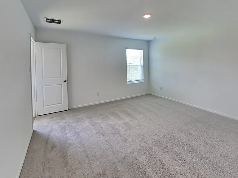 Spacious, well-lit room with n