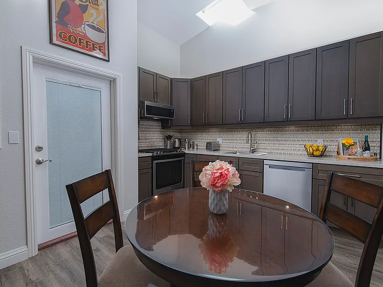 In kitchen dinning area four person.