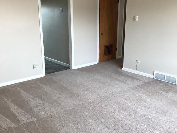 Living room with storage room door