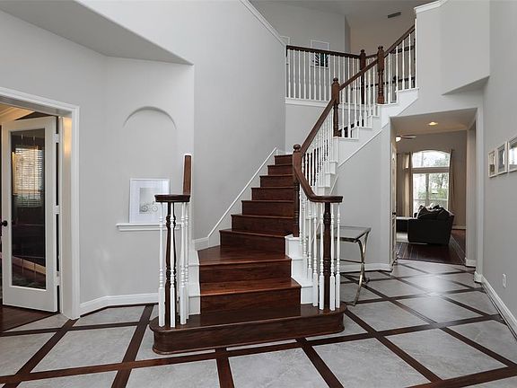 study/office is located to the left of the stairs, dining room to the right