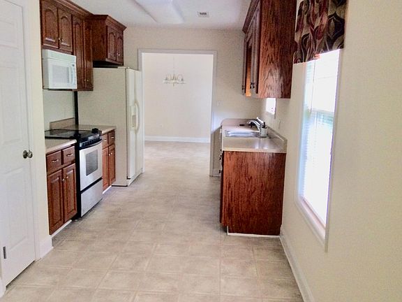 Includes side-by-side refrigerator with ice maker, microwave