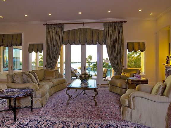 The grand salon opens to the terrace leading to the pool below