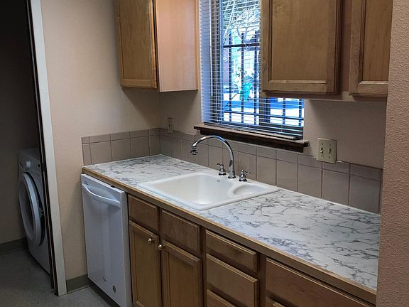 Laundry off the kitchen.