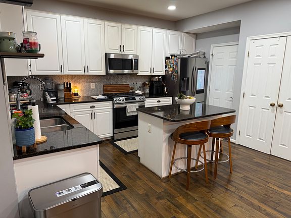 Kitchen with Island, Range, Microwave with exhaust, Dishwasher, Refrigerator