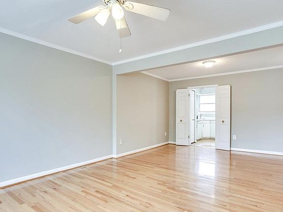 Family room looking into dining room. Fan has been replaced with a brand new light fixture.