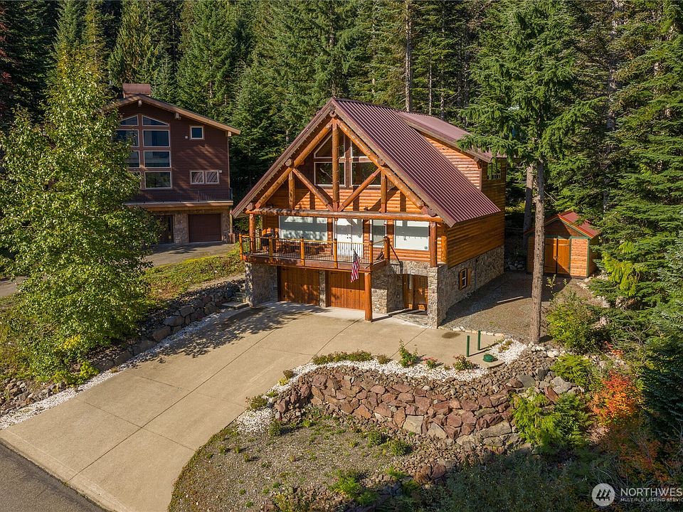 Step into a beautiful custom built European style chalet, with heated driveway>