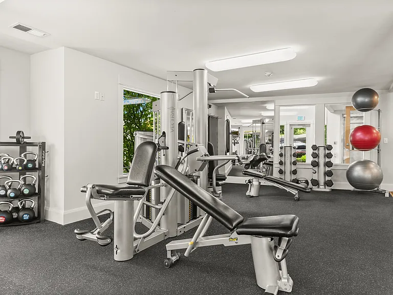 Spacious workout area with free weights and strength training machines.