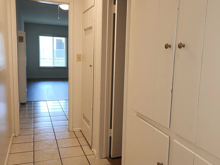 Hallway with linen closet