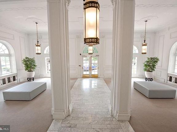 Foyer view from stairs to elevator to front door.