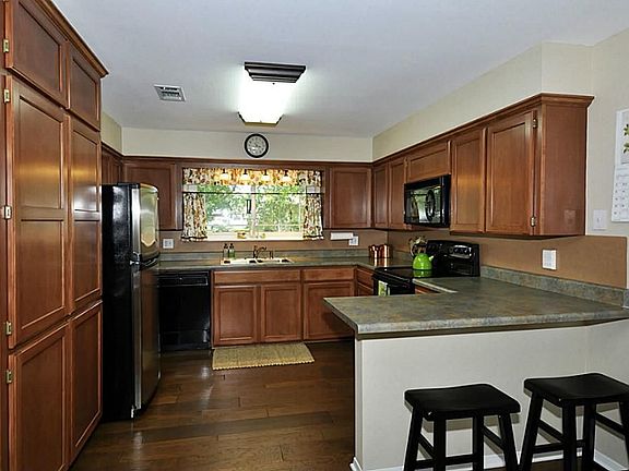 Another view of this great kitchen. Notice the breakfast bar. This bar is perfect for a snack or just talking to the chef.