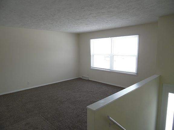 Upstairs living room 15'1" x 13'1" Large window faces front of house