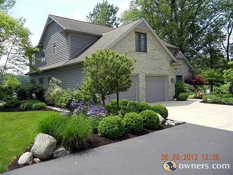 Eand and front of home, natural stone, cedar siding