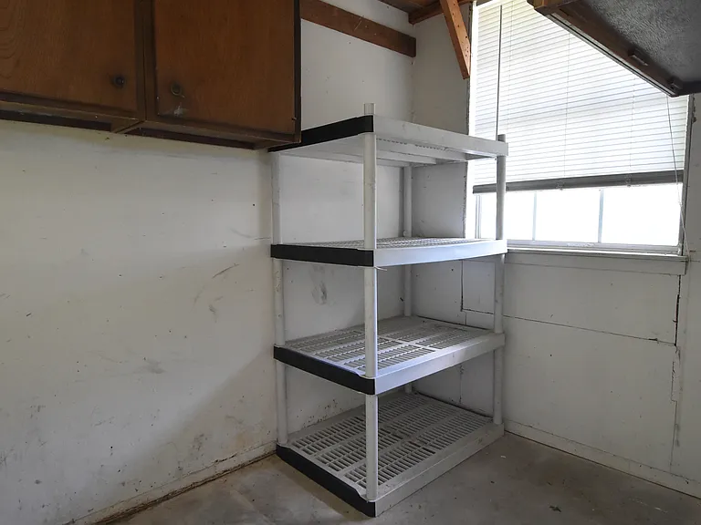 Plenty of storage space available in the private laundry room.