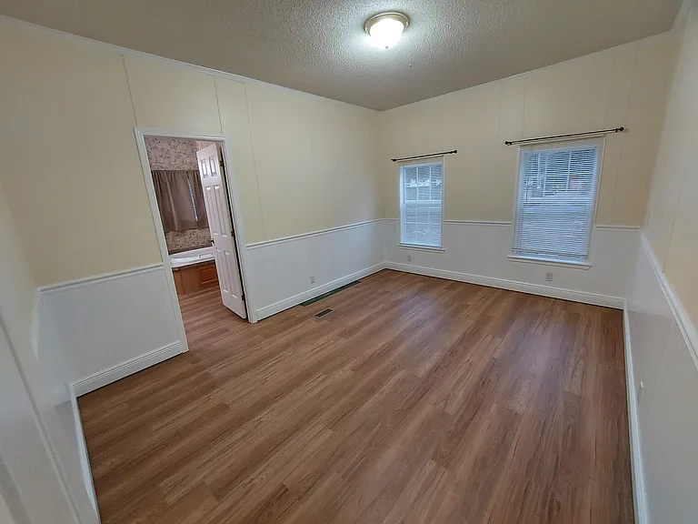 Front Master Bedroom (by front door). Note 9' ceilings throughout the home give every room a large feel.