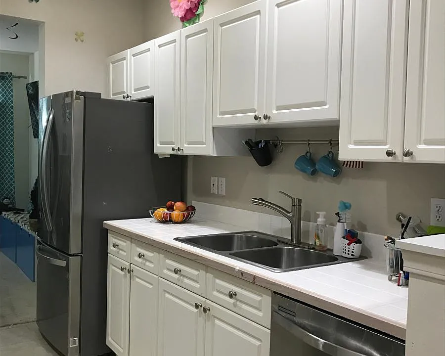 Beautiful white kitchen with new stainless steel appliances