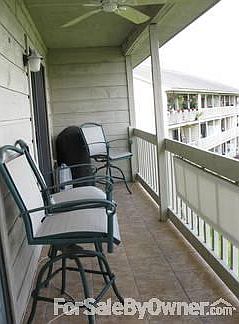 Large Balcony : Enjoy spectacular sunsets over the Halfmoon River. Overlooks pool and marina.