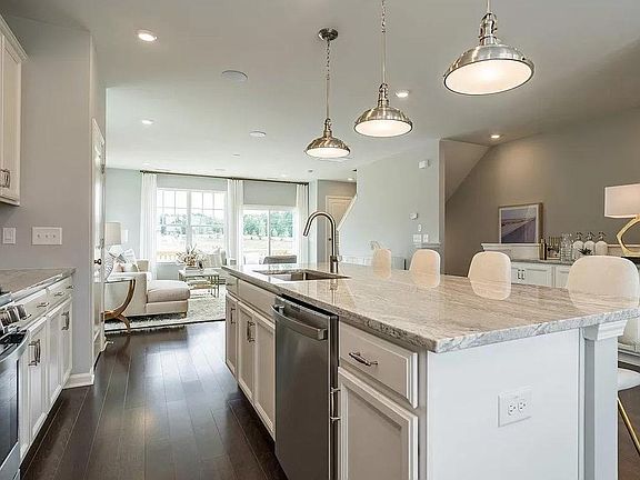 Kitchen and family of the model home with same floor plan.