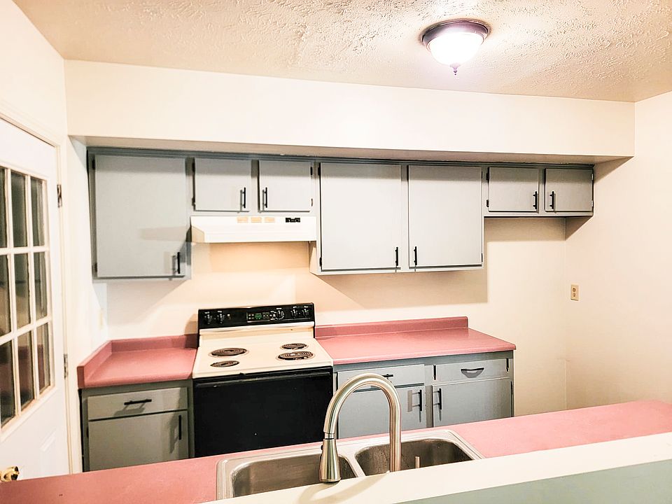 Kitchen with all new wall paint, cabinet hardware, cabinet paint, and new kitchen faucet.