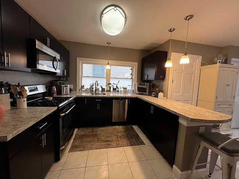 gas stove / great working space with large window and natural light.