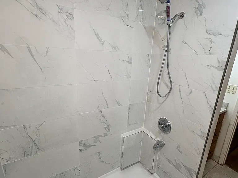 New porcelain-tiled shower