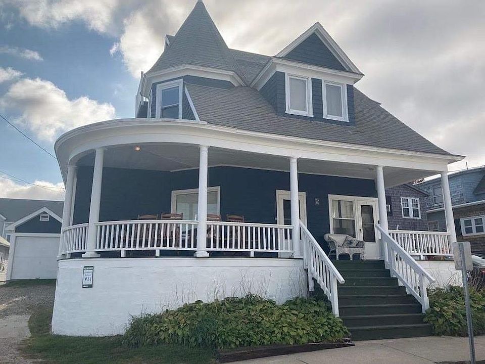 Front view with wraparound porch