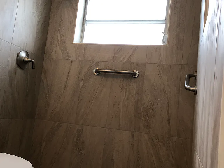 Shower tiled floor to ceiling and new Kohler fixtures