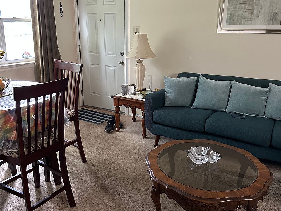 he overall design balances comfort and style, with open sightlines, coordinated decor, and room for movement, giving the entire space a welcoming and airy feel.