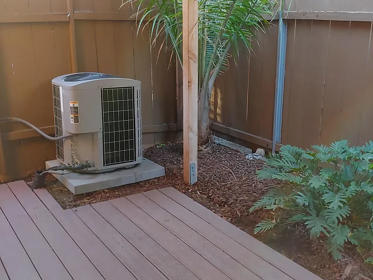 Covered back deck with AC Unit.