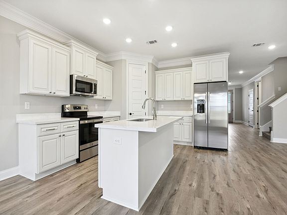 Kitchen in the Dune floorplan at a Meritage Homes community in Gulfport, MS.