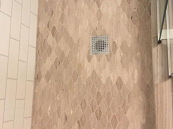 Master bath limestone floor in shower