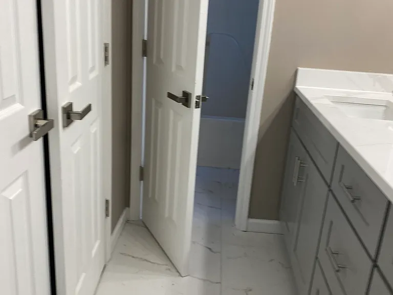 Second full bath upstairs with double vanity and closet.