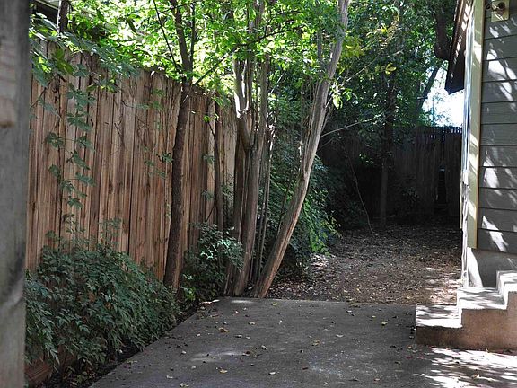 Quaint fenced side yard