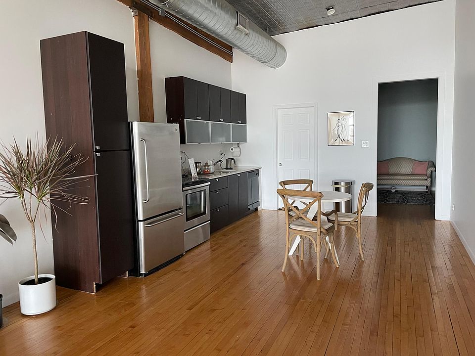 Large kitchen with stainless stove ,refridgerater and dishwasher.Modern cabinets
