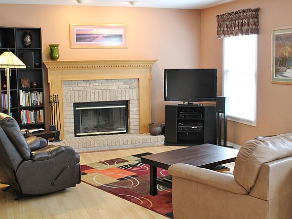 Lovely Family Room with newer hardwood floors and beautiful Fireplace!