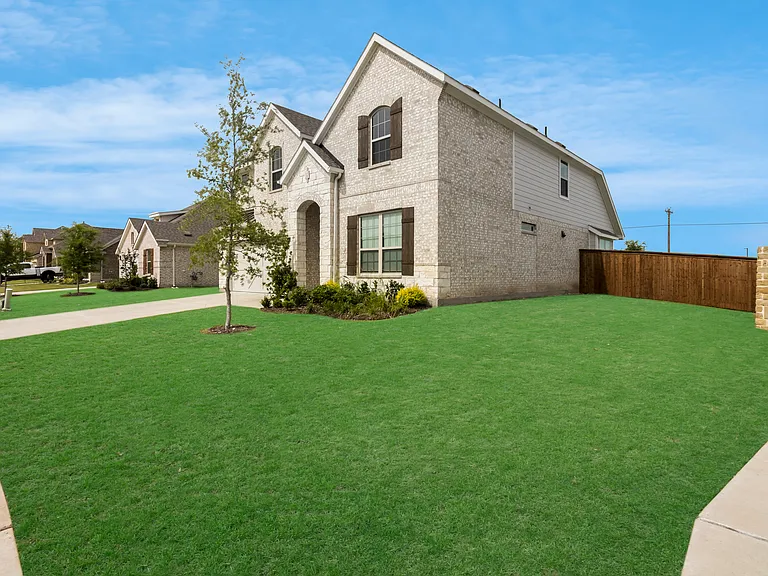 Large Corner lot w/ rear Brick fence 
Upgrade