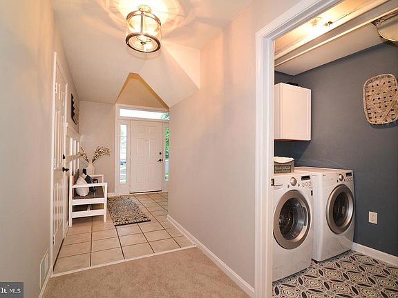 Updated lighting & cabinets in laundry